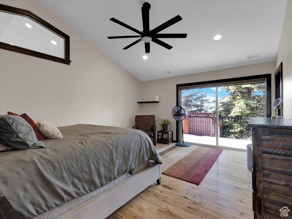 Bedroom featuring access to outside, light hardwood / wood-style floors, ceiling fan, and lofted ceiling