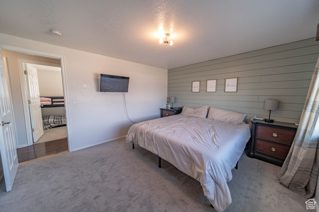 Bedroom with light colored carpet