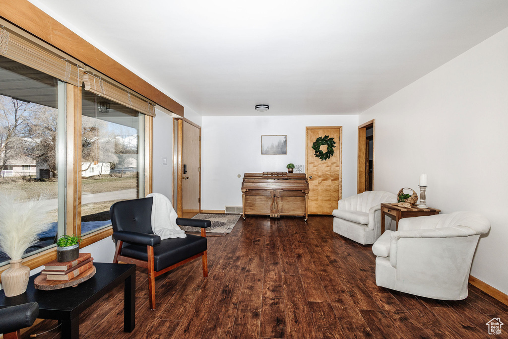 Living area featuring dark hardwood / wood-style flooring