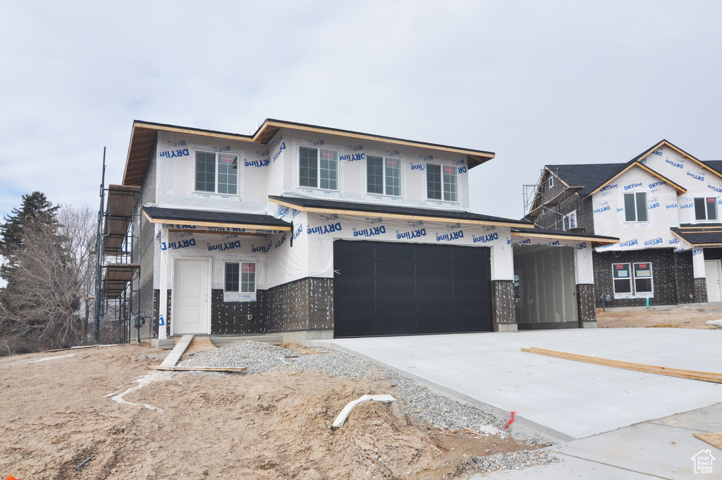 Property in mid-construction with a garage