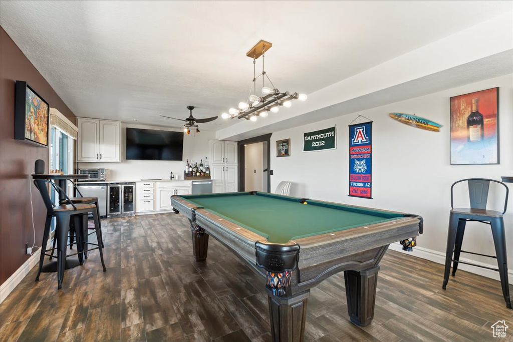 Playroom with ceiling fan, dark hardwood / wood-style floors, and pool table