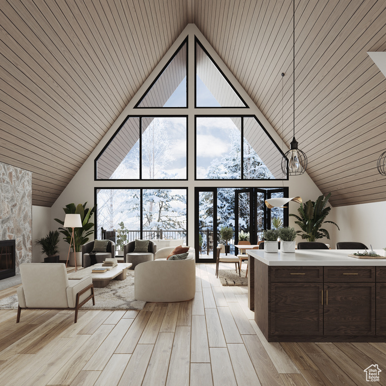 Interior space featuring a fireplace, light hardwood / wood-style flooring, wooden ceiling, and high vaulted ceiling