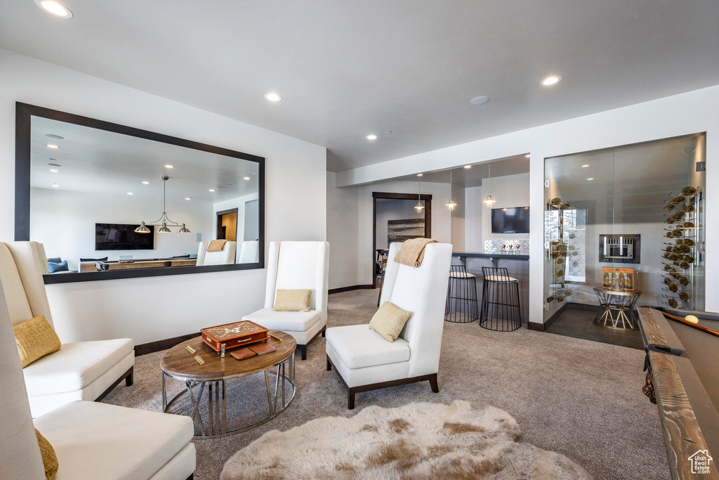 Living room featuring billiards and hardwood / wood-style floors
