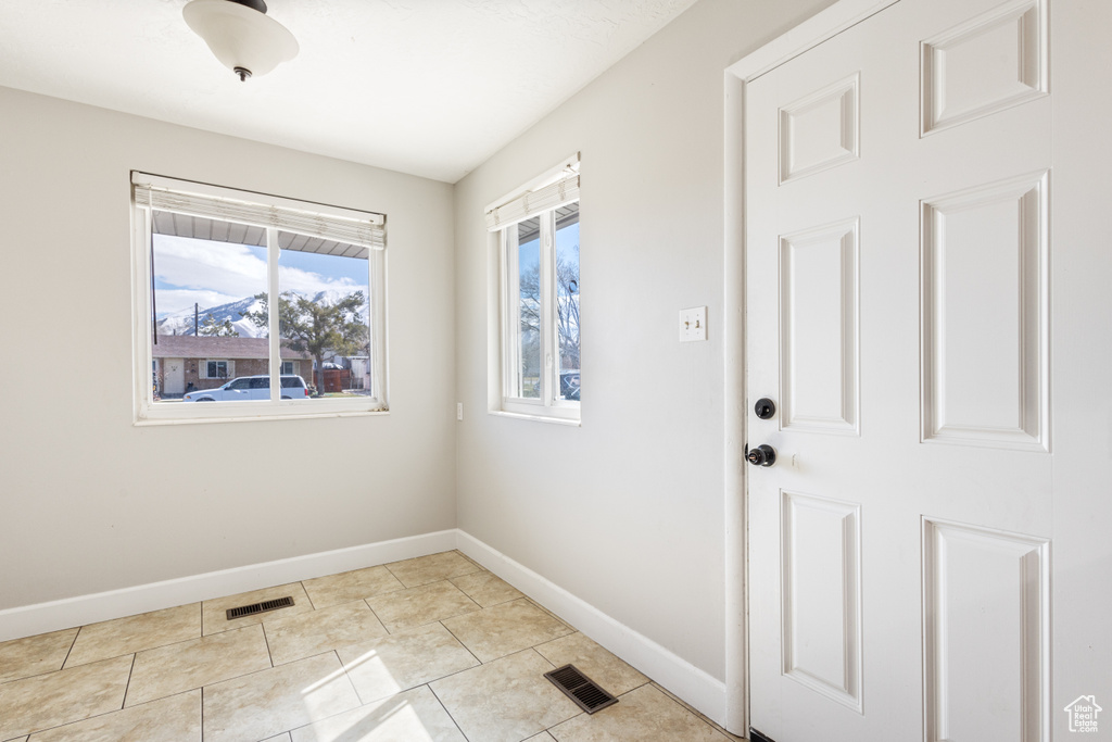 Entryway featuring light tile flooring