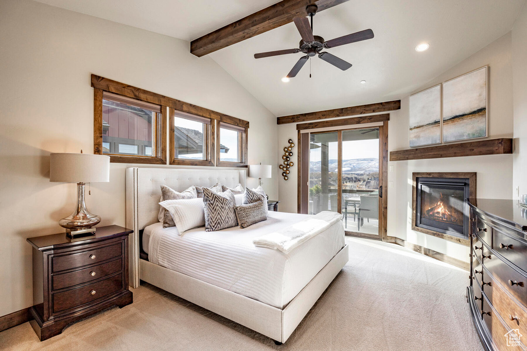 Bedroom with light carpet, access to outside, vaulted ceiling with beams, and ceiling fan