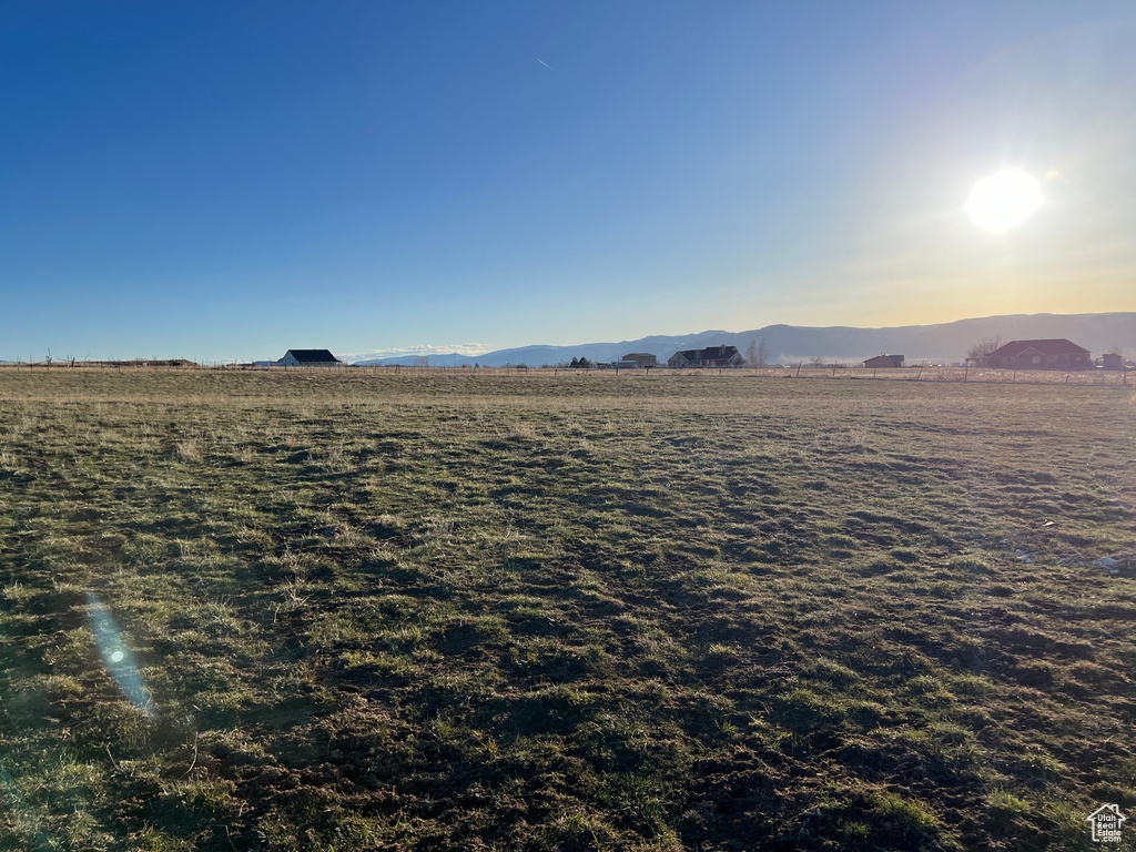 Property view of mountains with a rural view