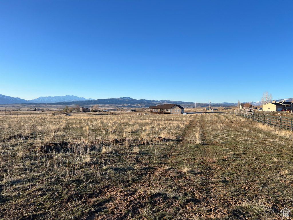 Property view of mountains with a rural view