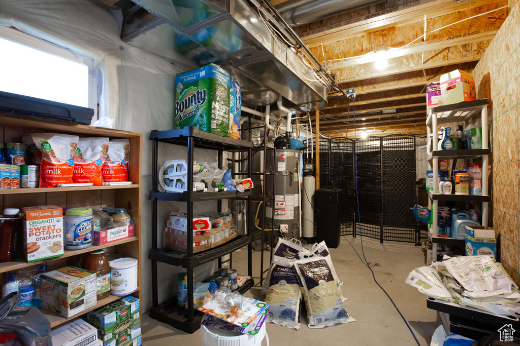 Storage room featuring gas water heater