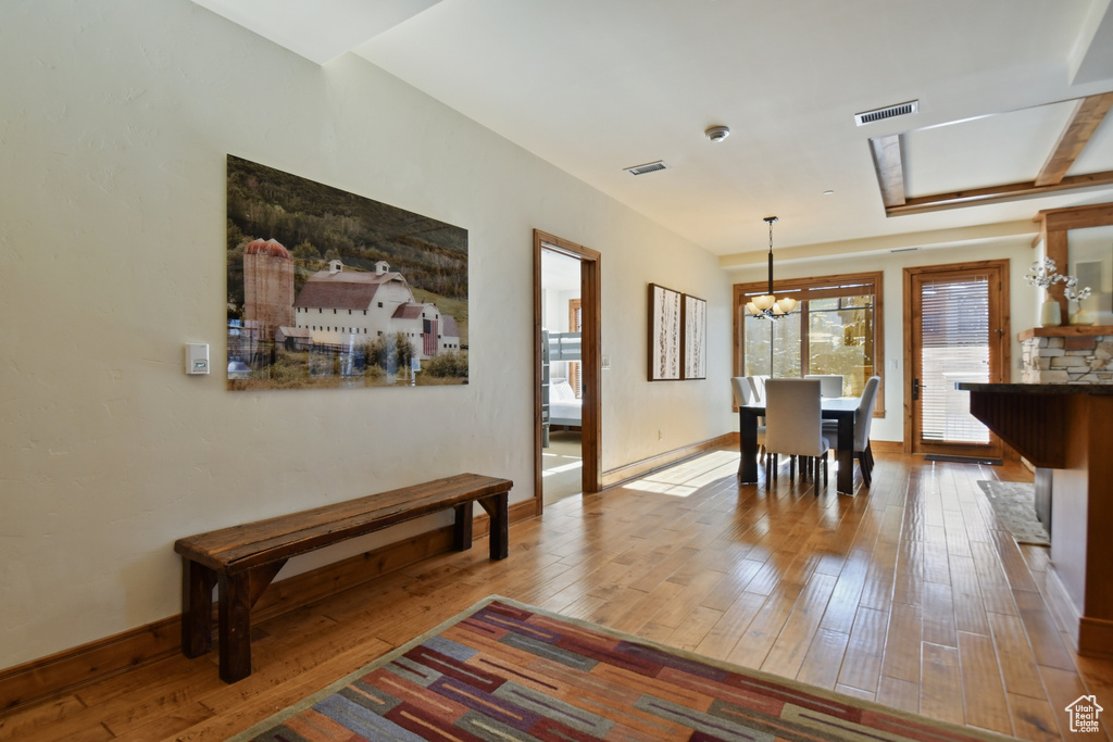 Interior space featuring a notable chandelier and light hardwood / wood-style floors
