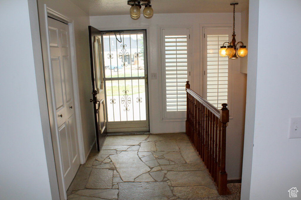 Entryway featuring a chandelier