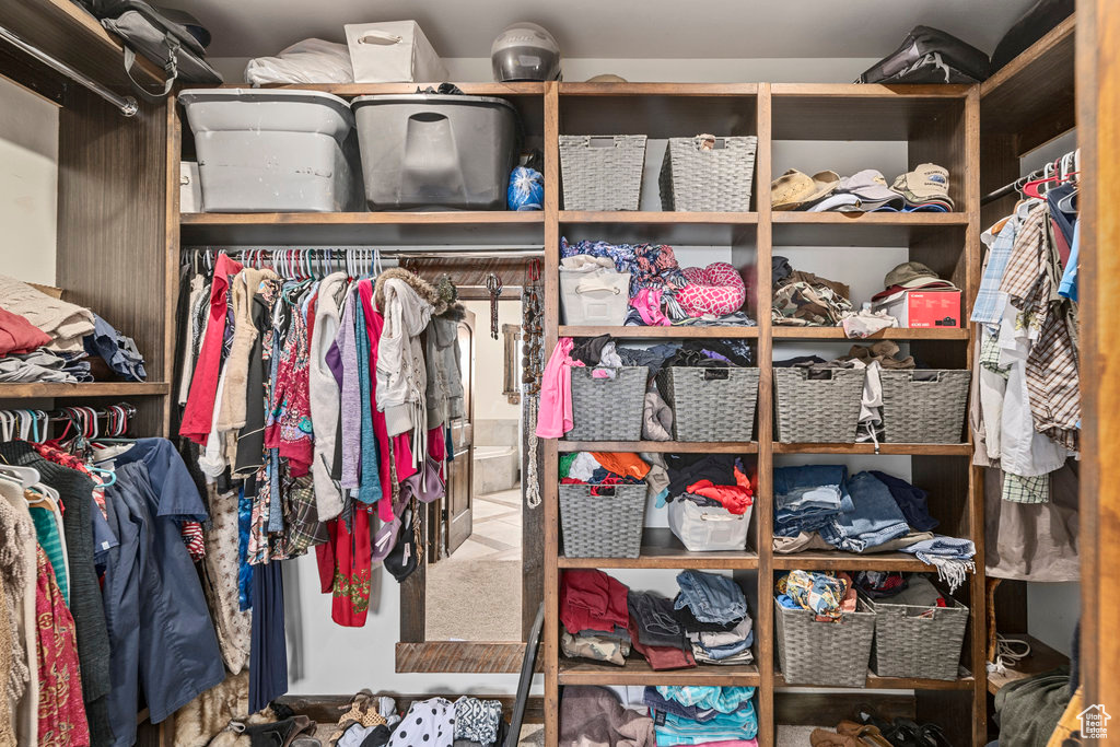 Spacious closet with carpet floors