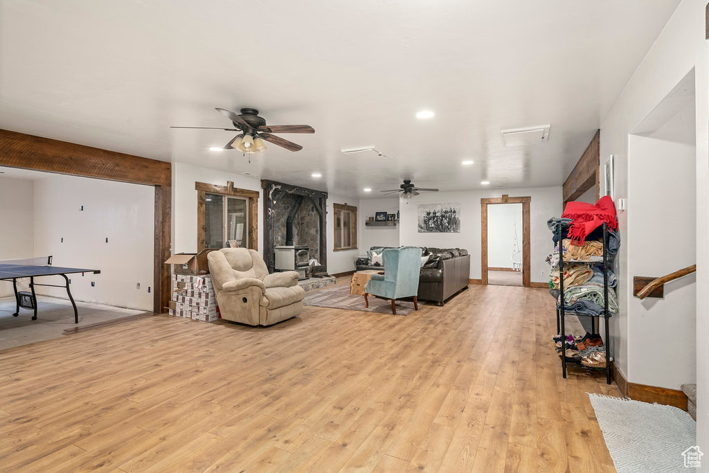 Living room featuring ceiling fan and light hardwood / wood-style floors