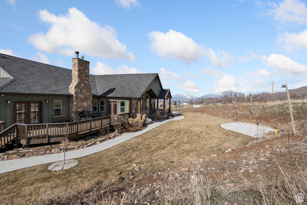 View of yard featuring a wooden deck