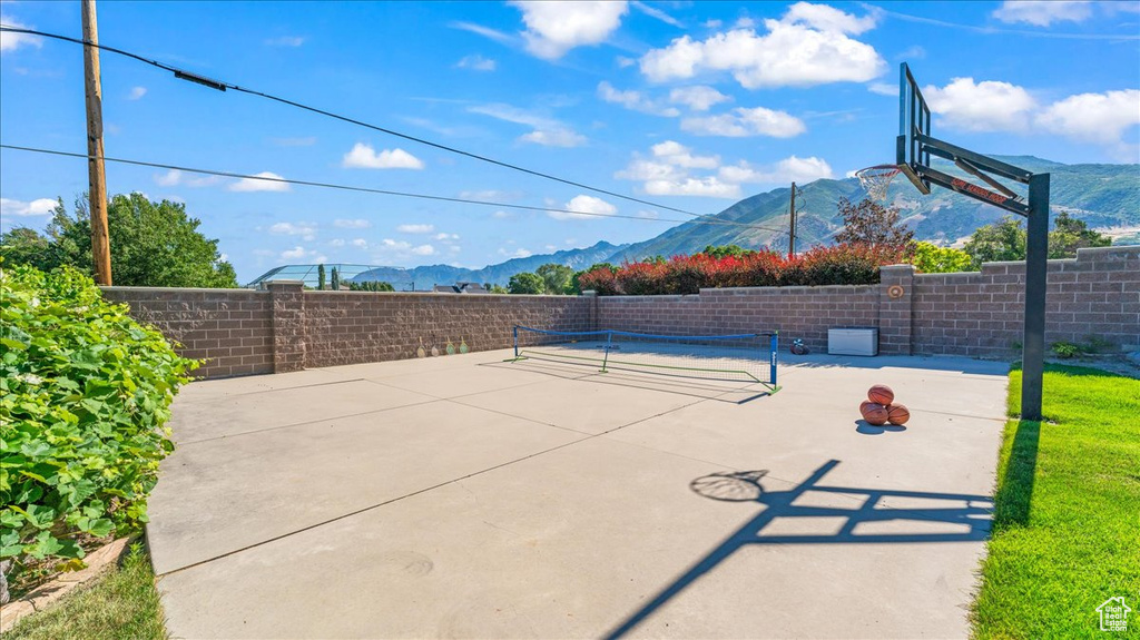 Exterior space featuring a mountain view and basketball court