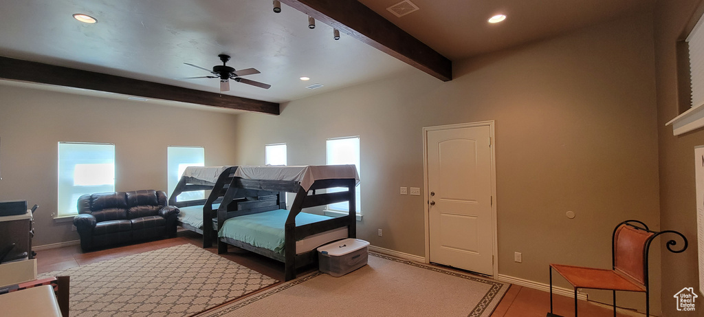 Bedroom featuring beamed ceiling and ceiling fan
