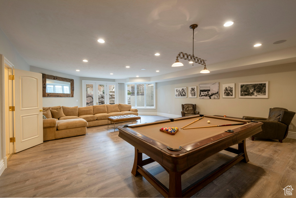 Playroom featuring light hardwood / wood-style floors and billiards