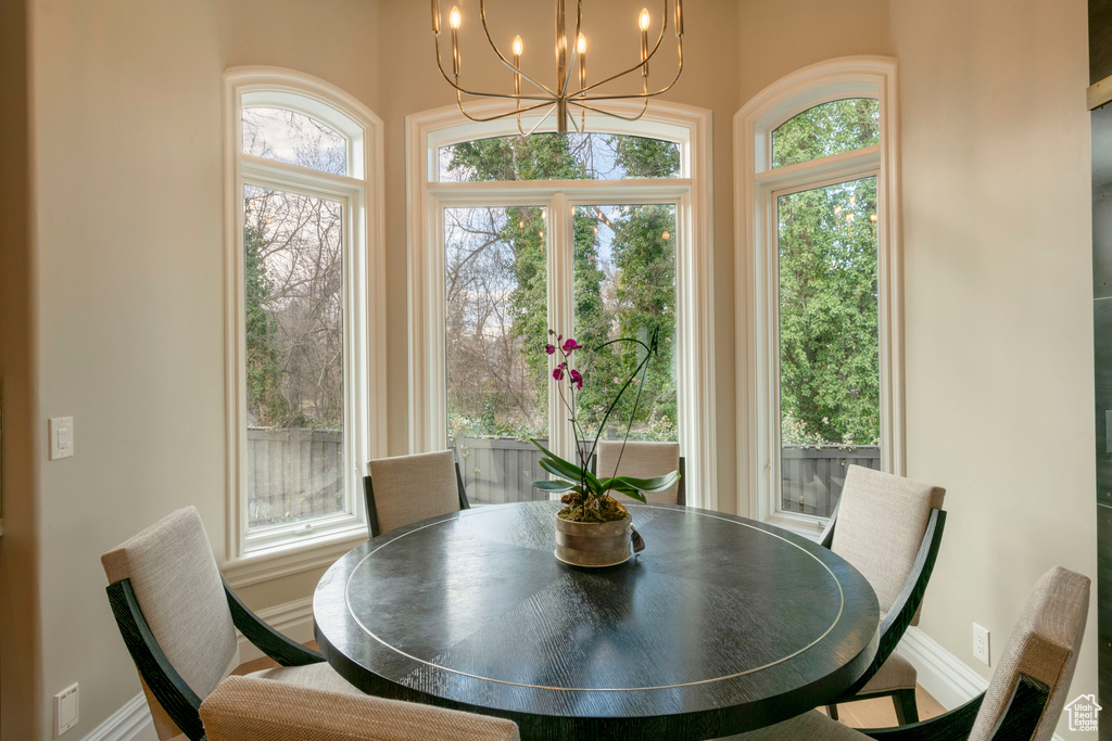 Dining room featuring plenty of natural light and a notable chandelier