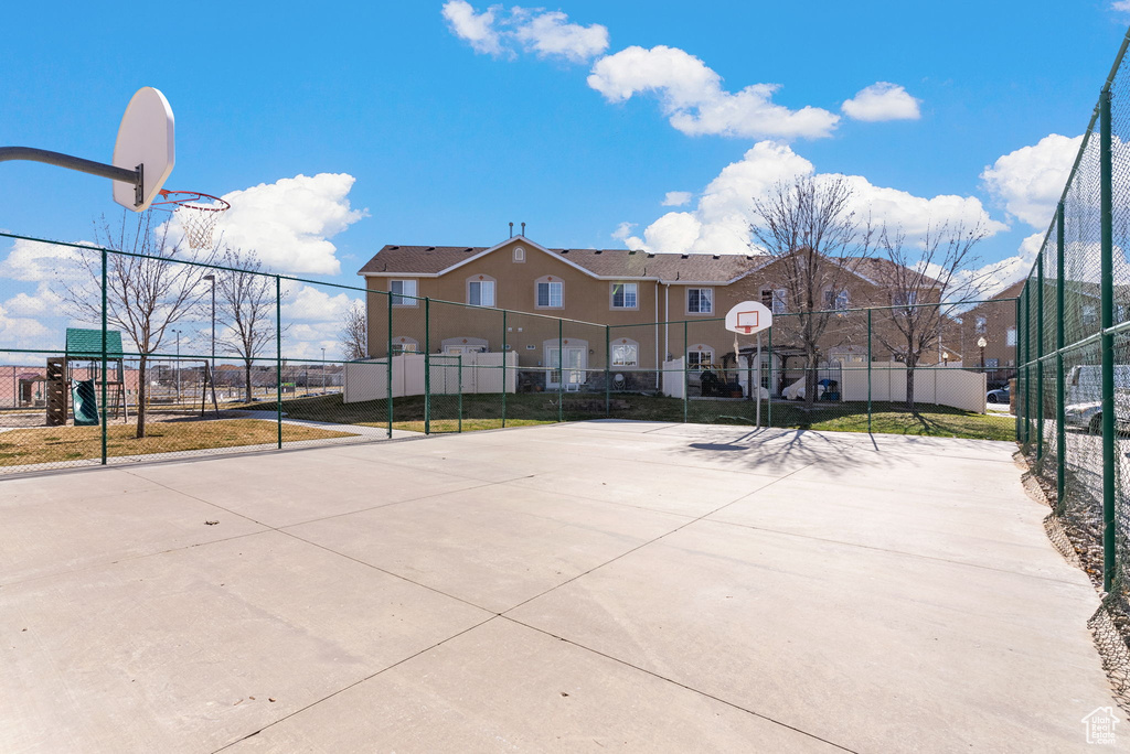 View of home\'s community featuring basketball court
