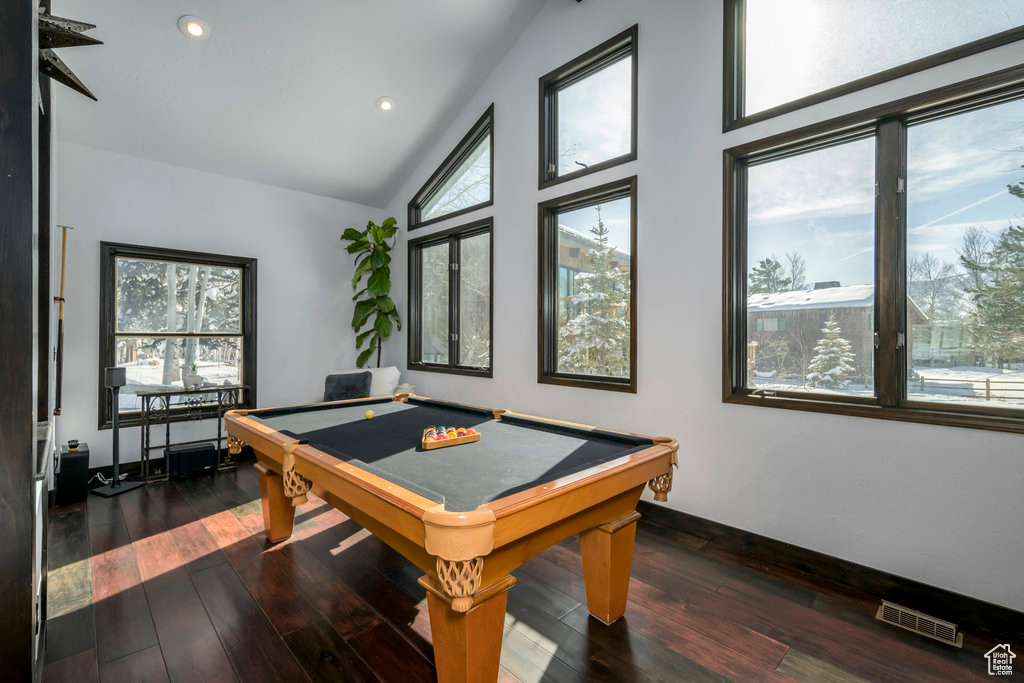 Rec room featuring dark wood-type flooring, vaulted ceiling, and pool table