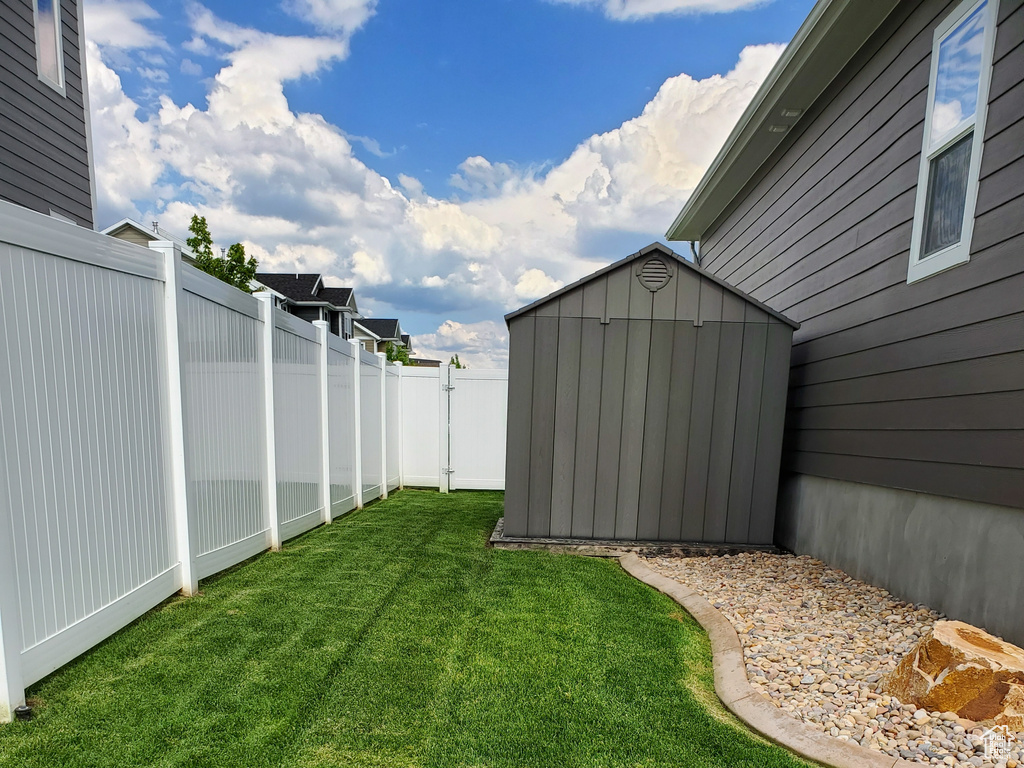 View of yard with a storage shed