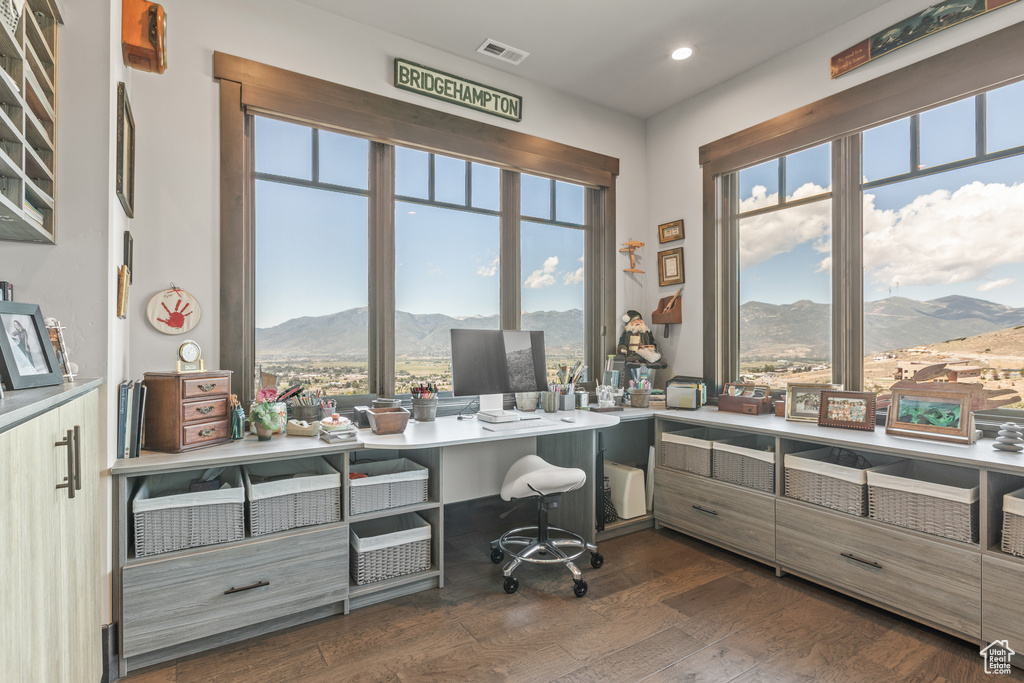 Home office featuring dark hardwood / wood-style flooring and a mountain view
