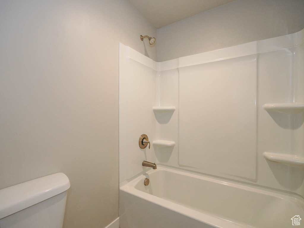 Bathroom with washtub / shower combination and toilet
