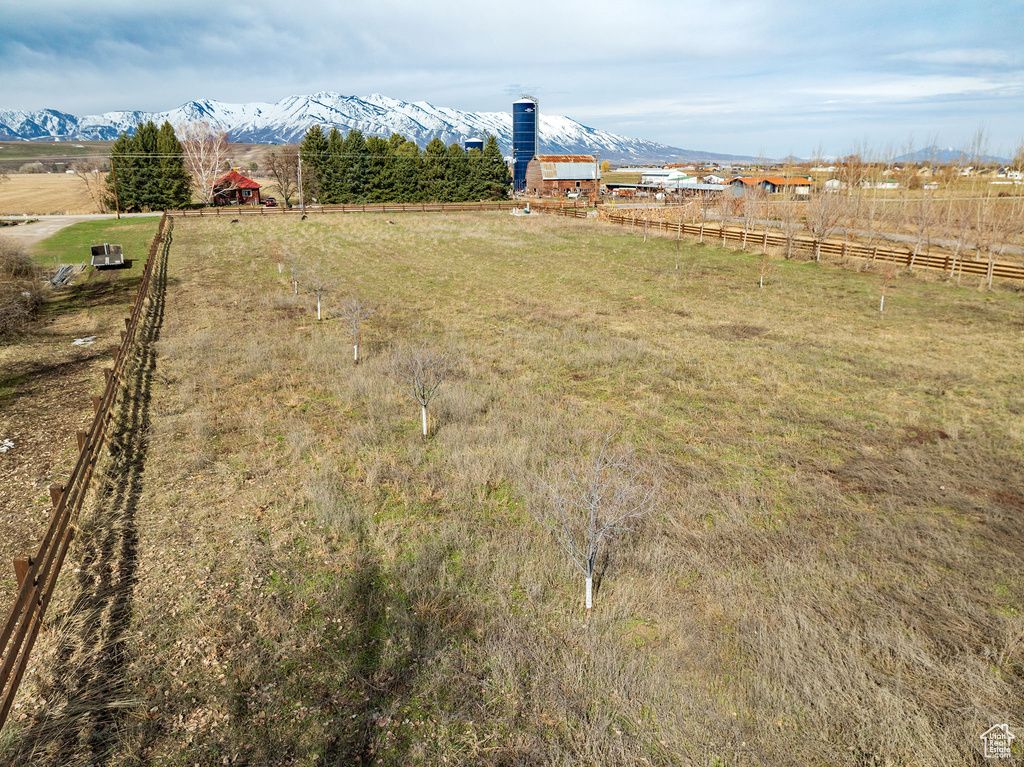 View of yard with a mountain view and a rural view