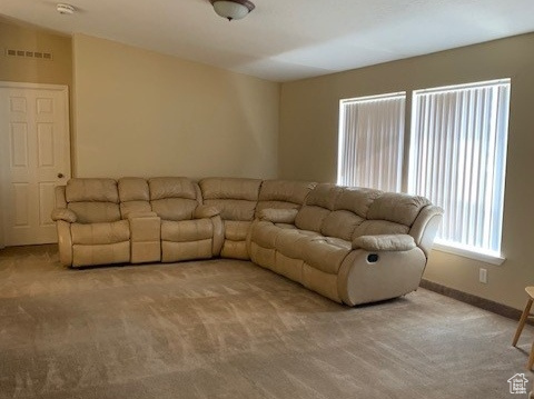 Unfurnished living room with carpet