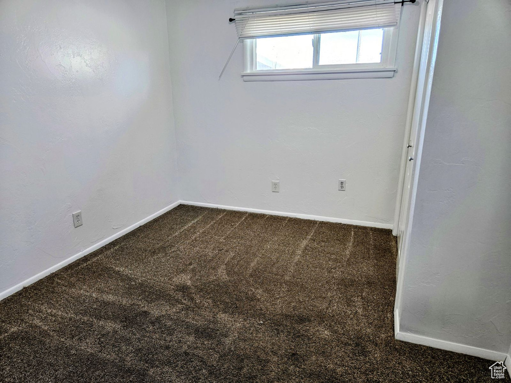 Empty room featuring carpet flooring