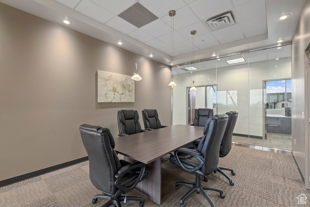 Office area with light colored carpet and a drop ceiling