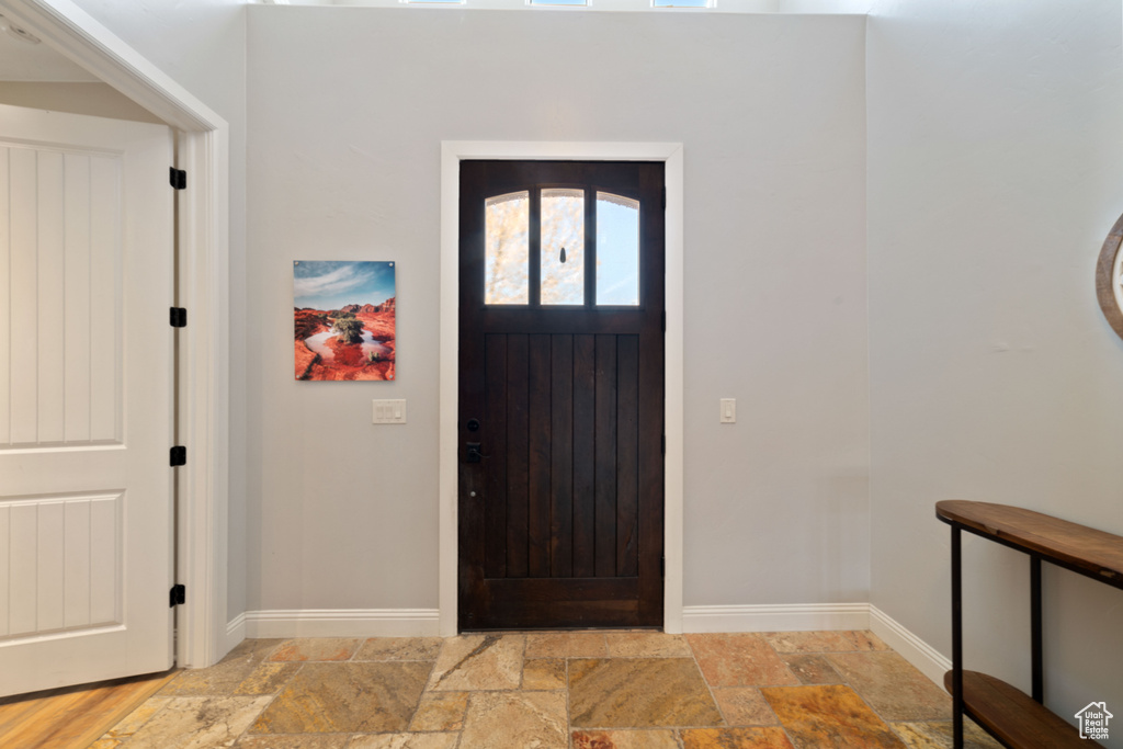Entrance foyer featuring light tile flooring