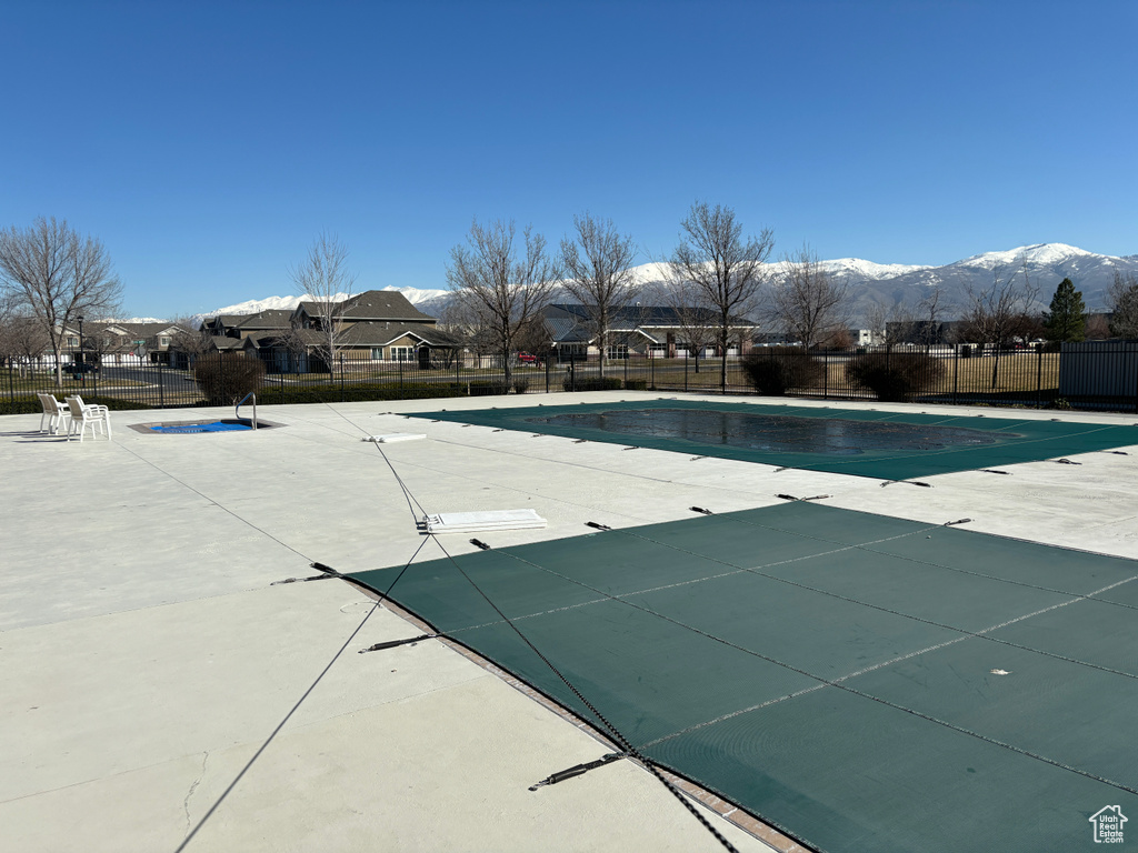 View of pool featuring a patio and a mountain view