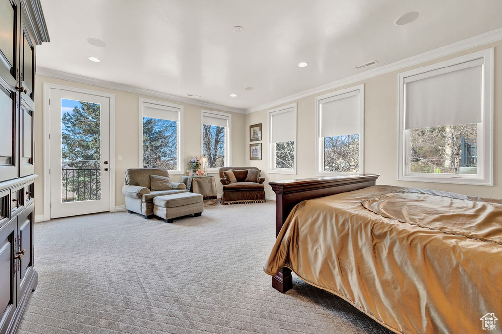 Carpeted bedroom with access to outside and crown molding