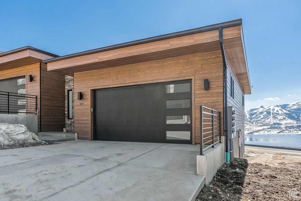 Exterior space featuring a mountain view and a garage