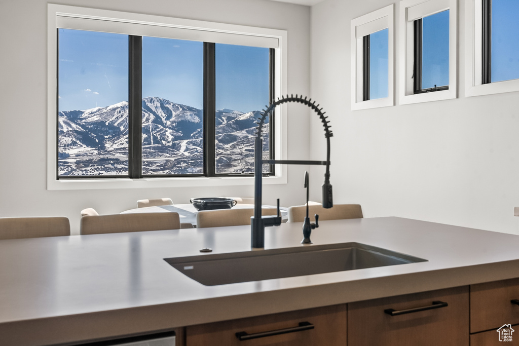 Interior space with a mountain view and sink