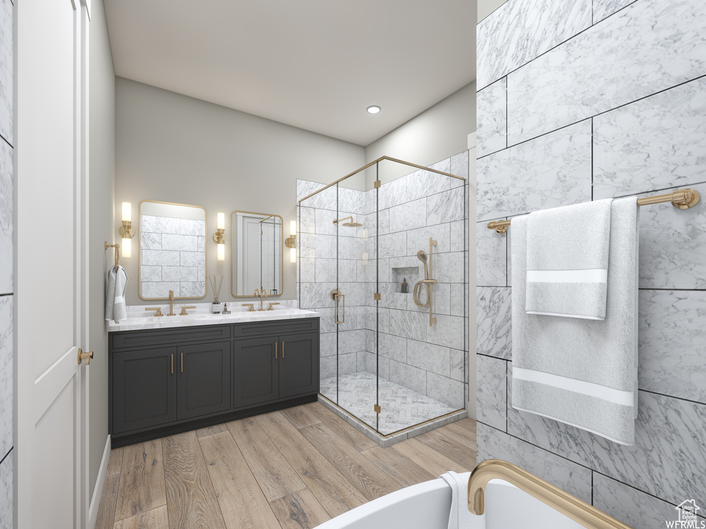 Bathroom with hardwood / wood-style floors, dual vanity, and shower with separate bathtub