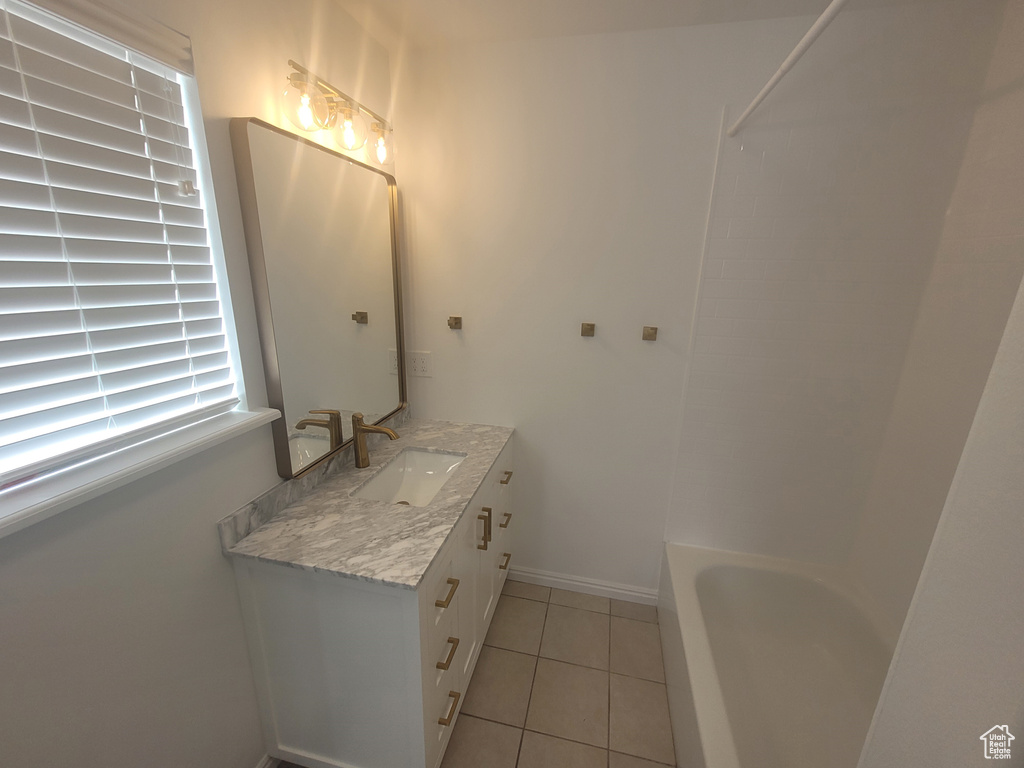 Bathroom with tile floors and large vanity