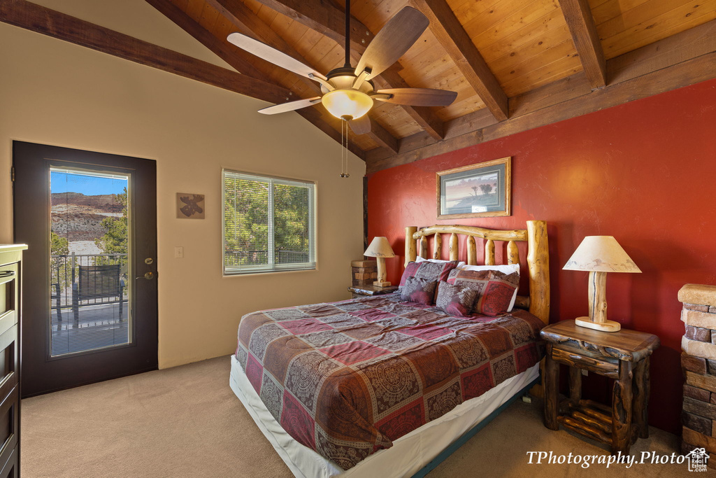 Carpeted bedroom featuring wood ceiling, lofted ceiling with beams, access to outside, and ceiling fan