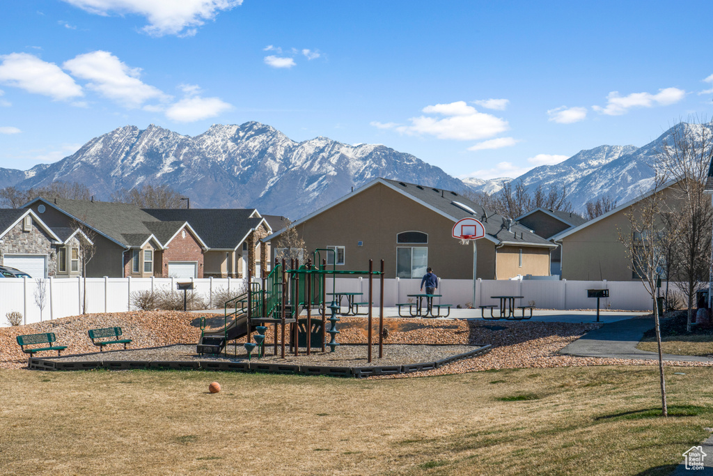 Exterior space featuring a mountain view and a playground
