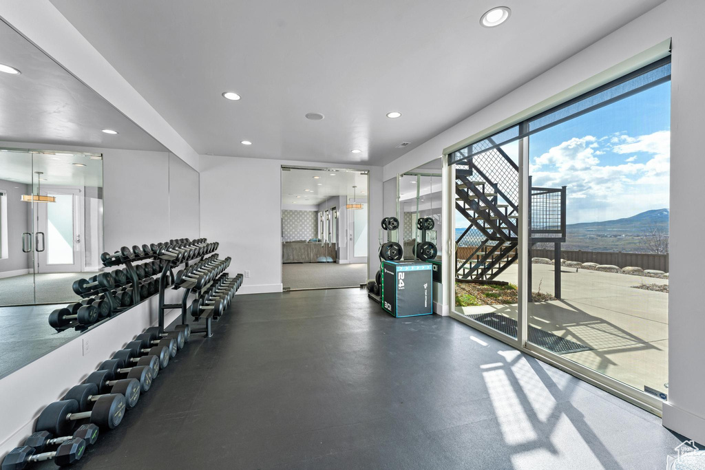 Workout area with a mountain view and a chandelier