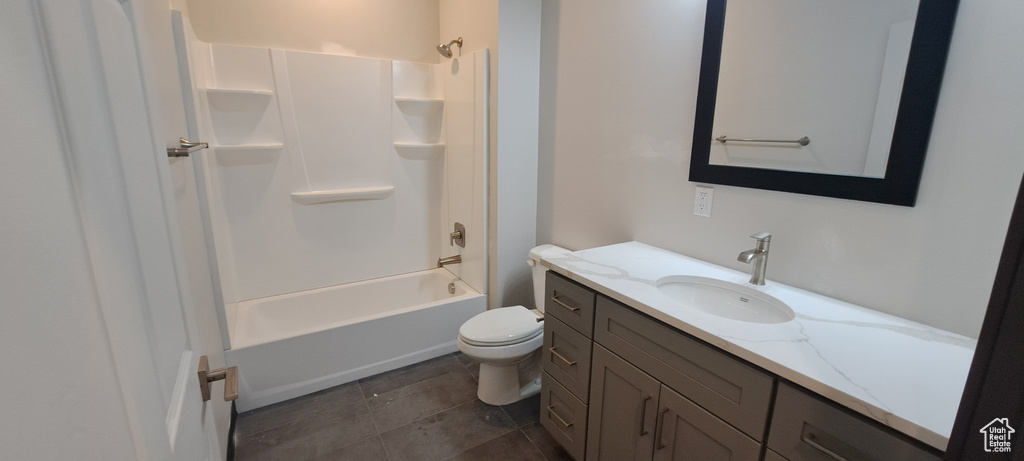 Full bathroom with vanity, tub / shower combination, toilet, and tile flooring