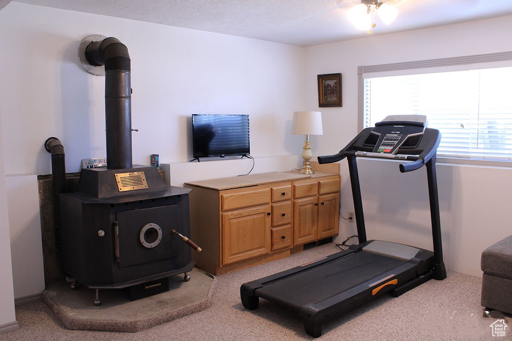 Workout area with a wood stove
