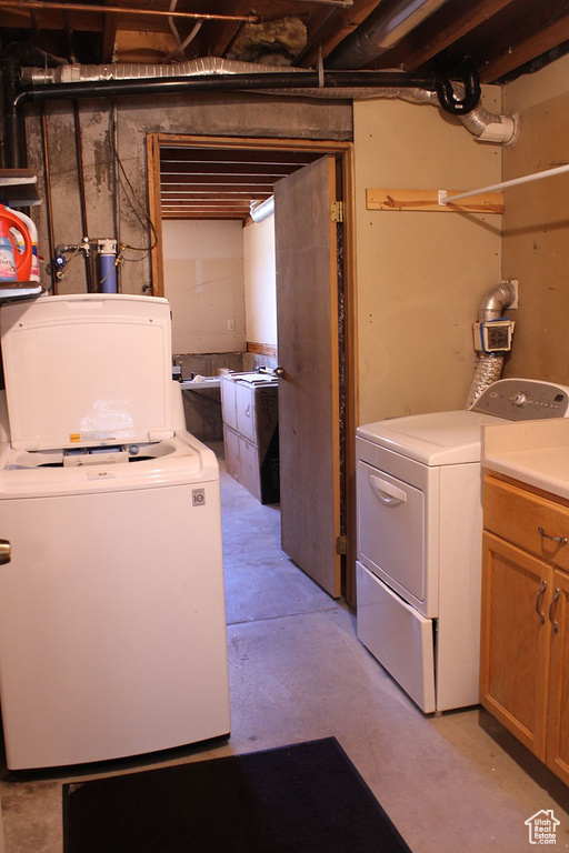 Laundry area featuring separate washer and dryer
