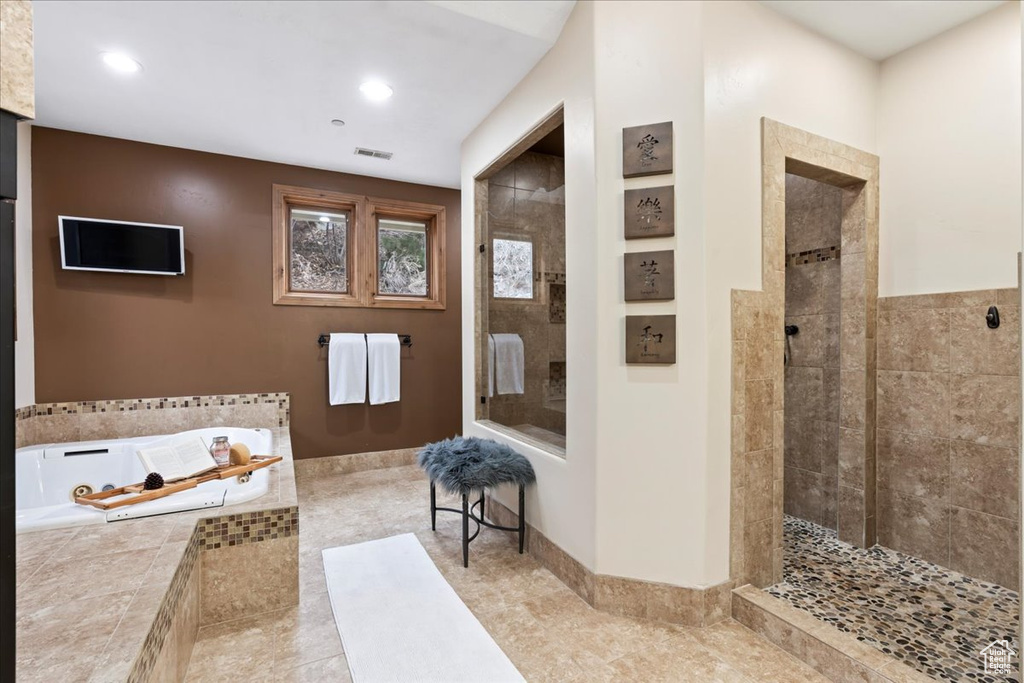 Bathroom with independent shower and bath and tile floors