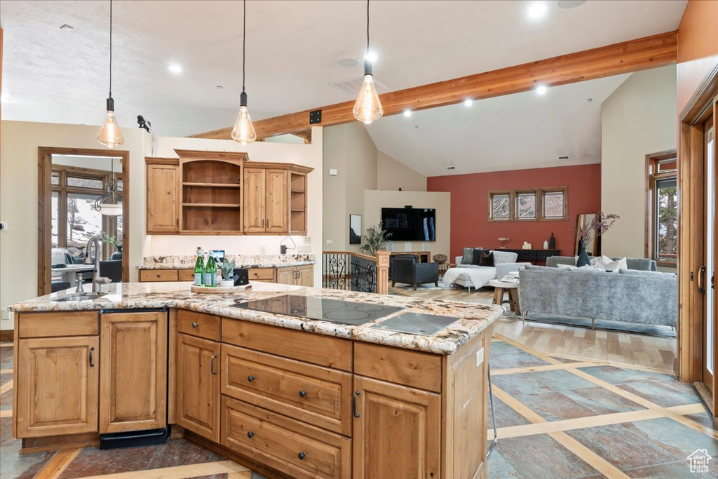 Kitchen with light stone countertops, pendant lighting, and dark wood-type flooring