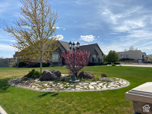 View of front of property with a front yard