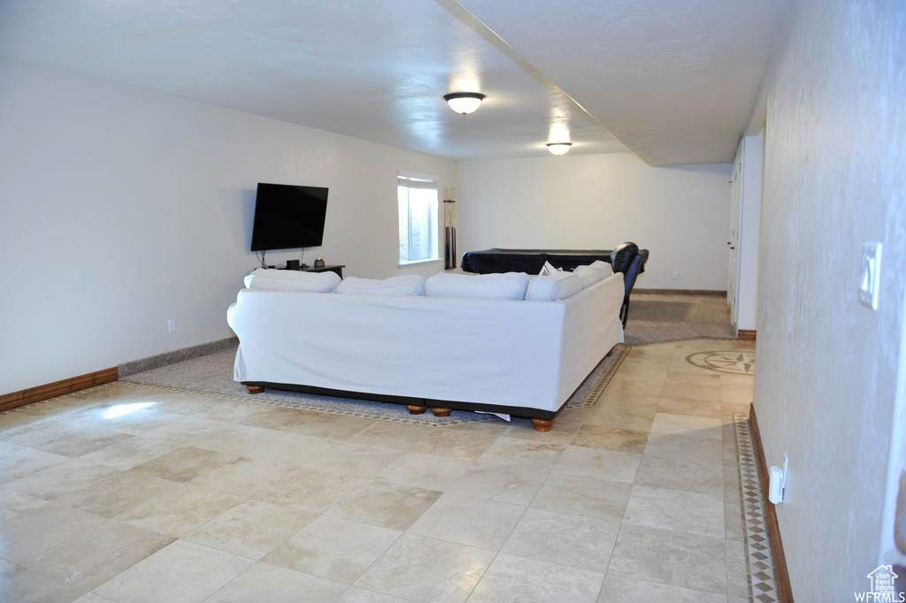 Living room with light tile flooring