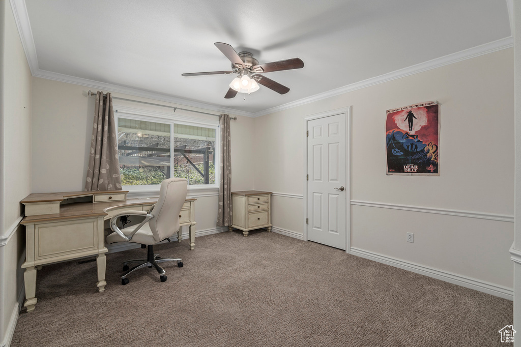Carpeted office space with crown molding and ceiling fan
