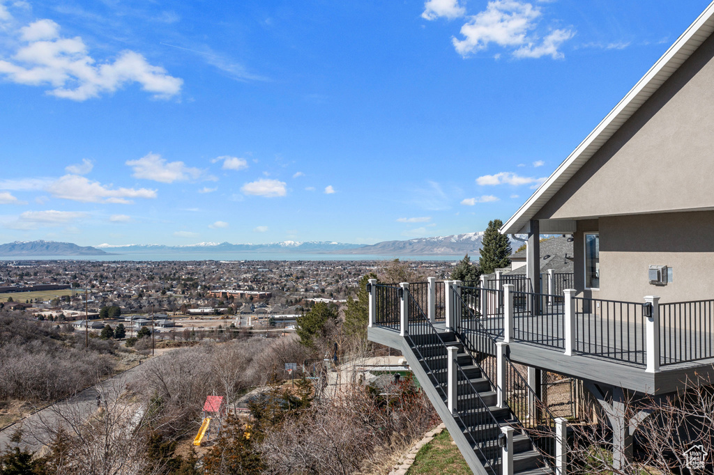 Exterior space featuring a deck with mountain view