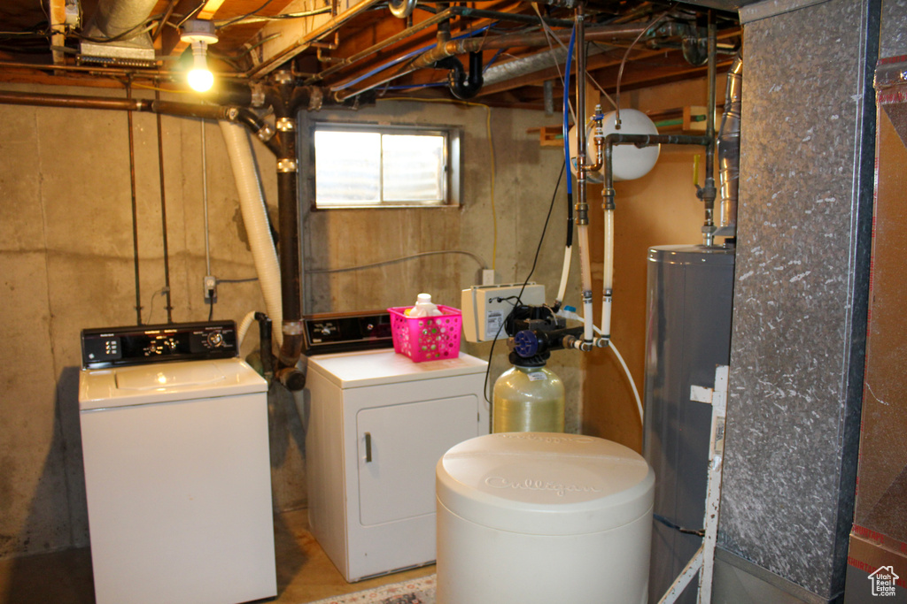 Laundry area with washer and dryer and gas water heater